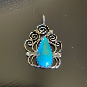 Turquoise and silver pendant